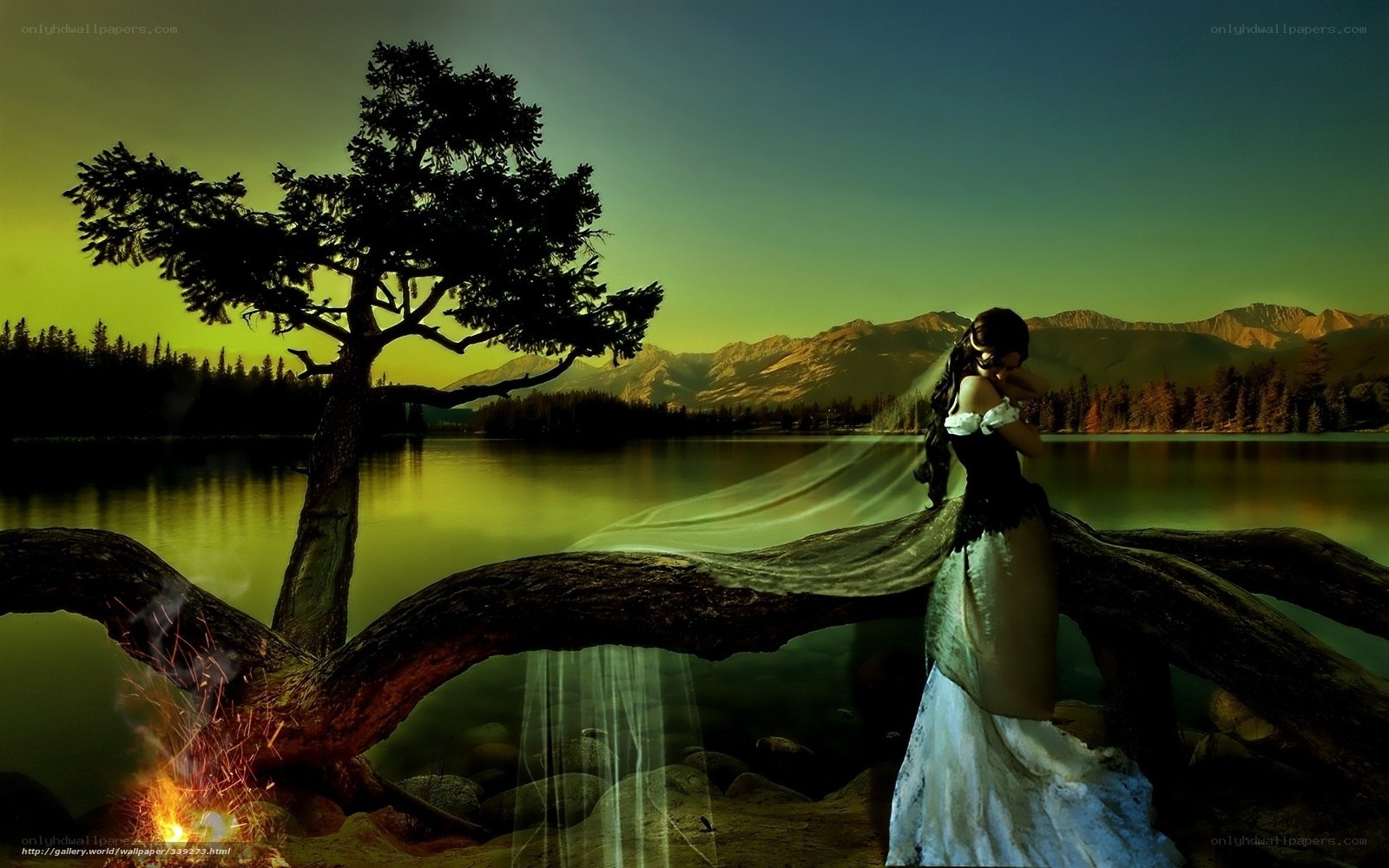 Woman by the lake at sunset