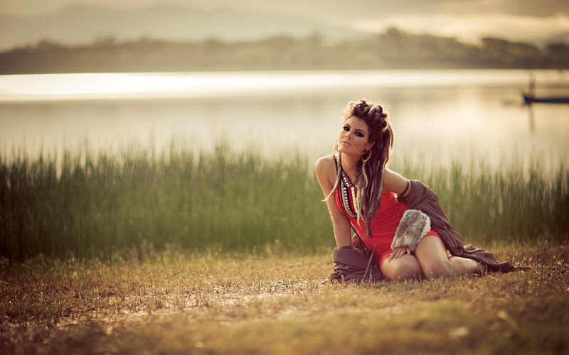 woman by the lake at sunset