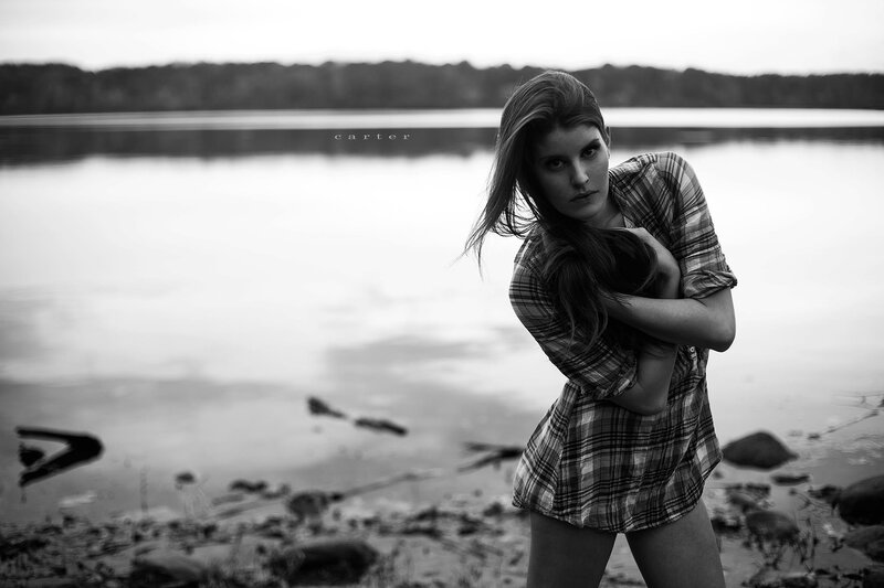 woman by the lake in plaid