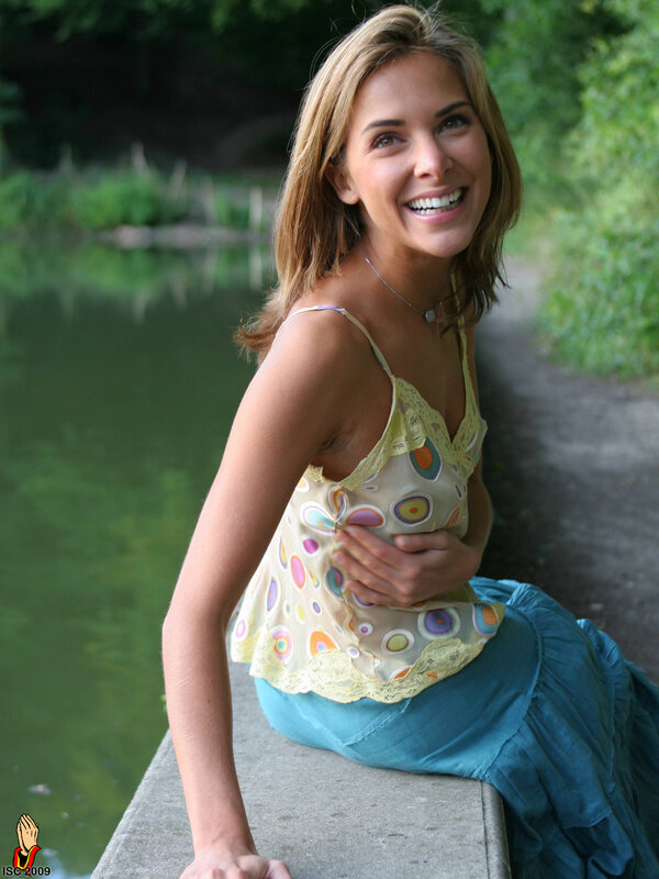 Woman by the pond smiling
