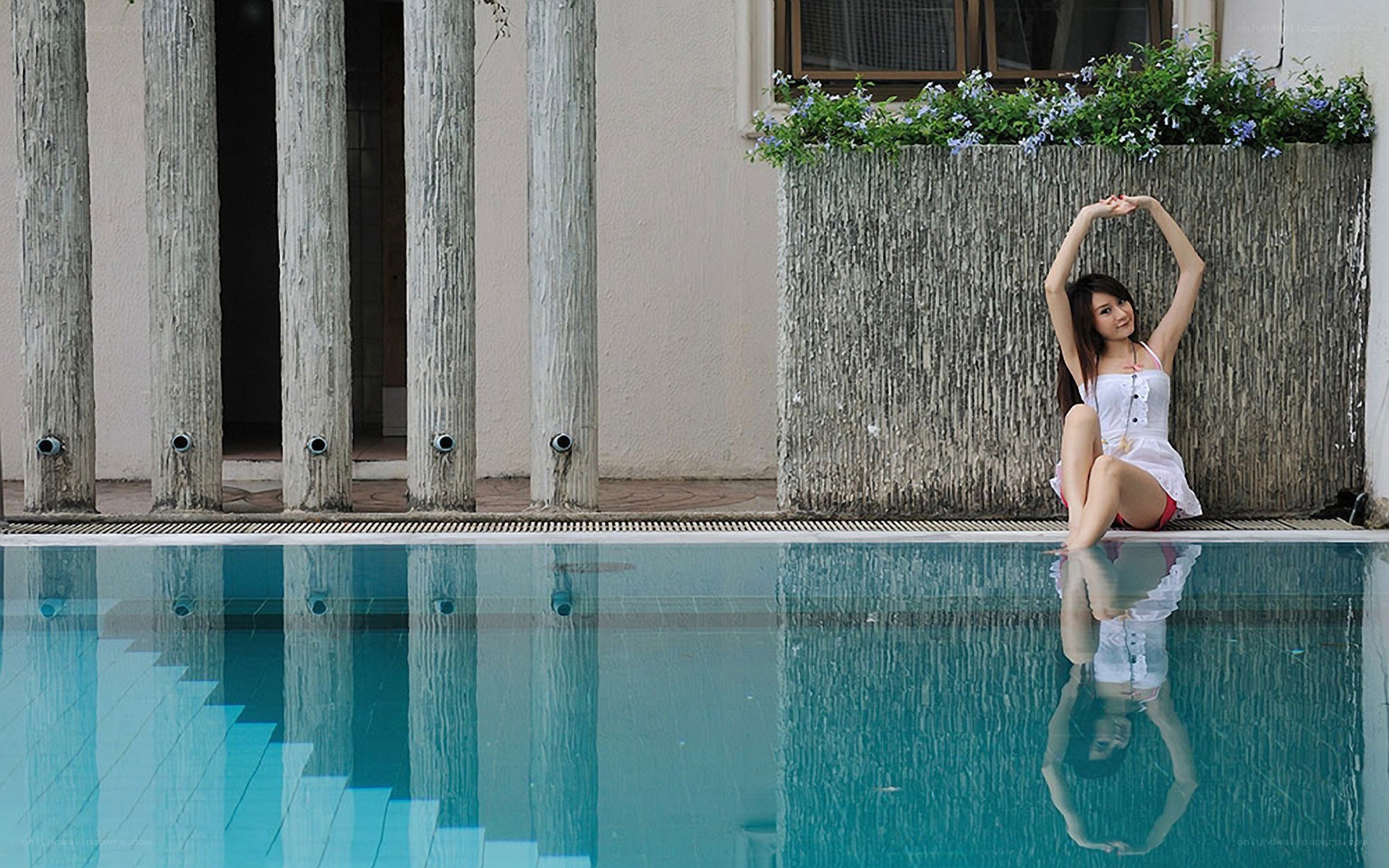Woman by the poolside