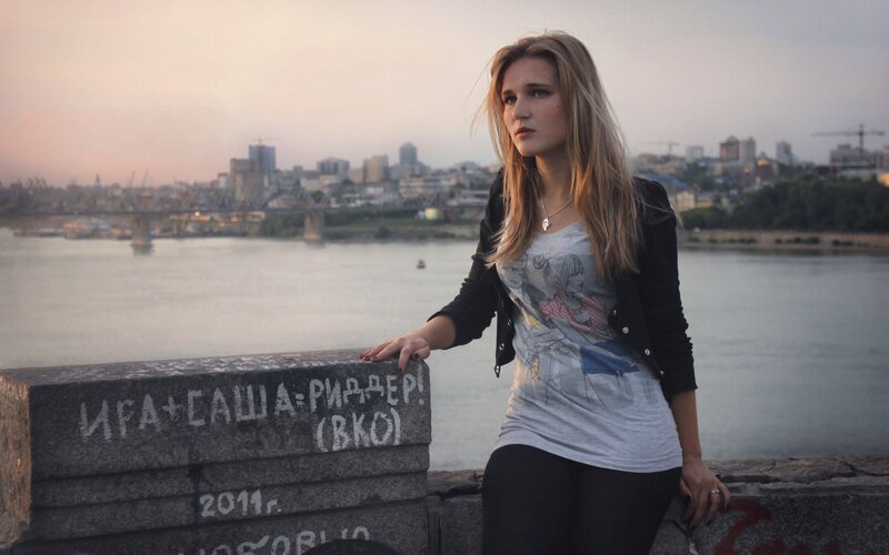 woman by the river at dusk