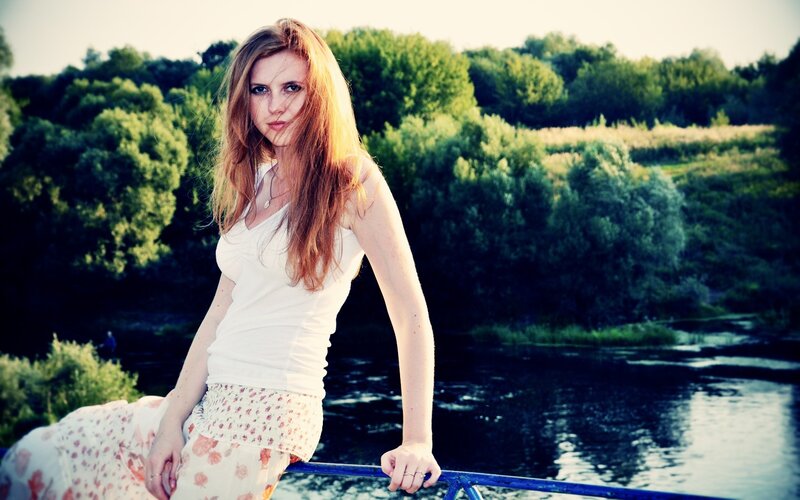 woman by the river at sunset