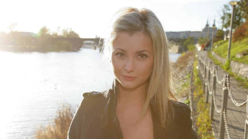 woman by the river at sunset