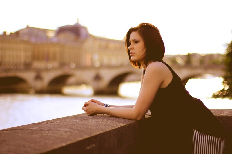 woman by the river at sunset