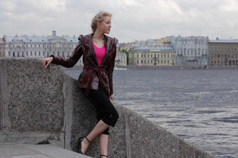 Woman by the river in city
