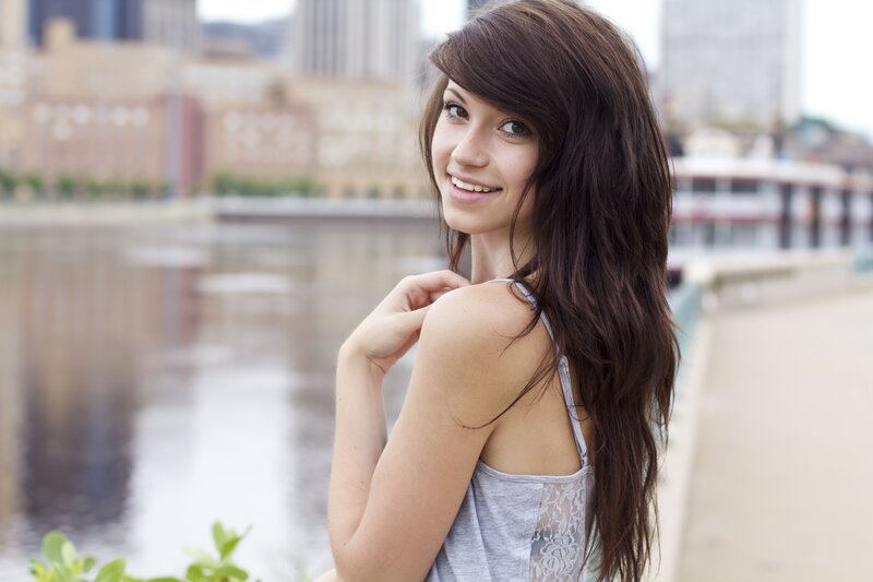 woman by the river smiling