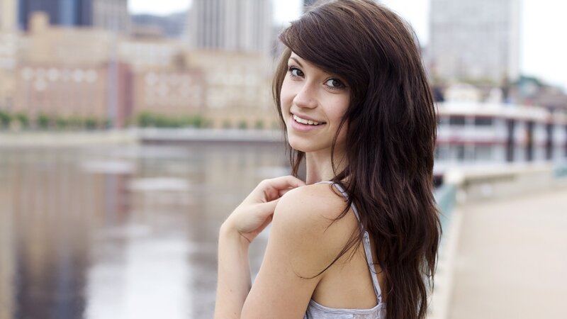 woman by the river smiling