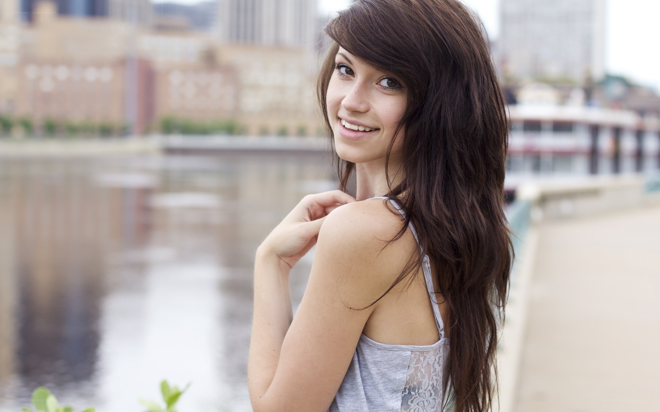 woman by the river smiling