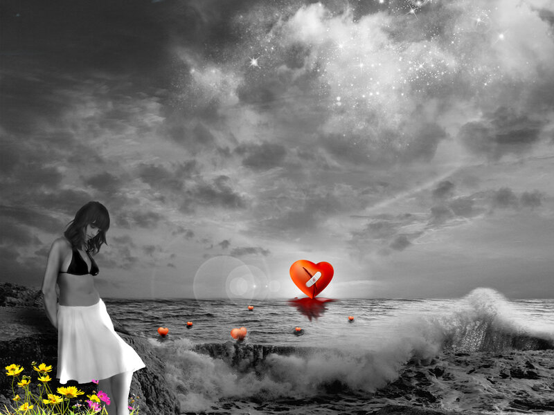 woman by the sea with heart