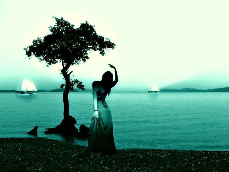 woman by the water at dusk