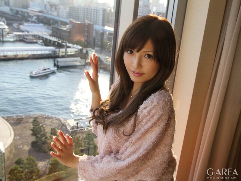 Woman by the window with city view