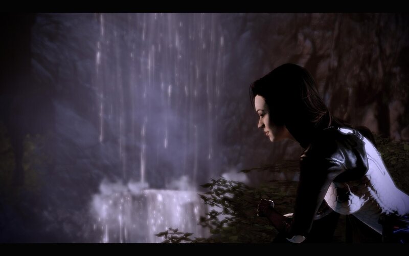 woman by waterfall at night