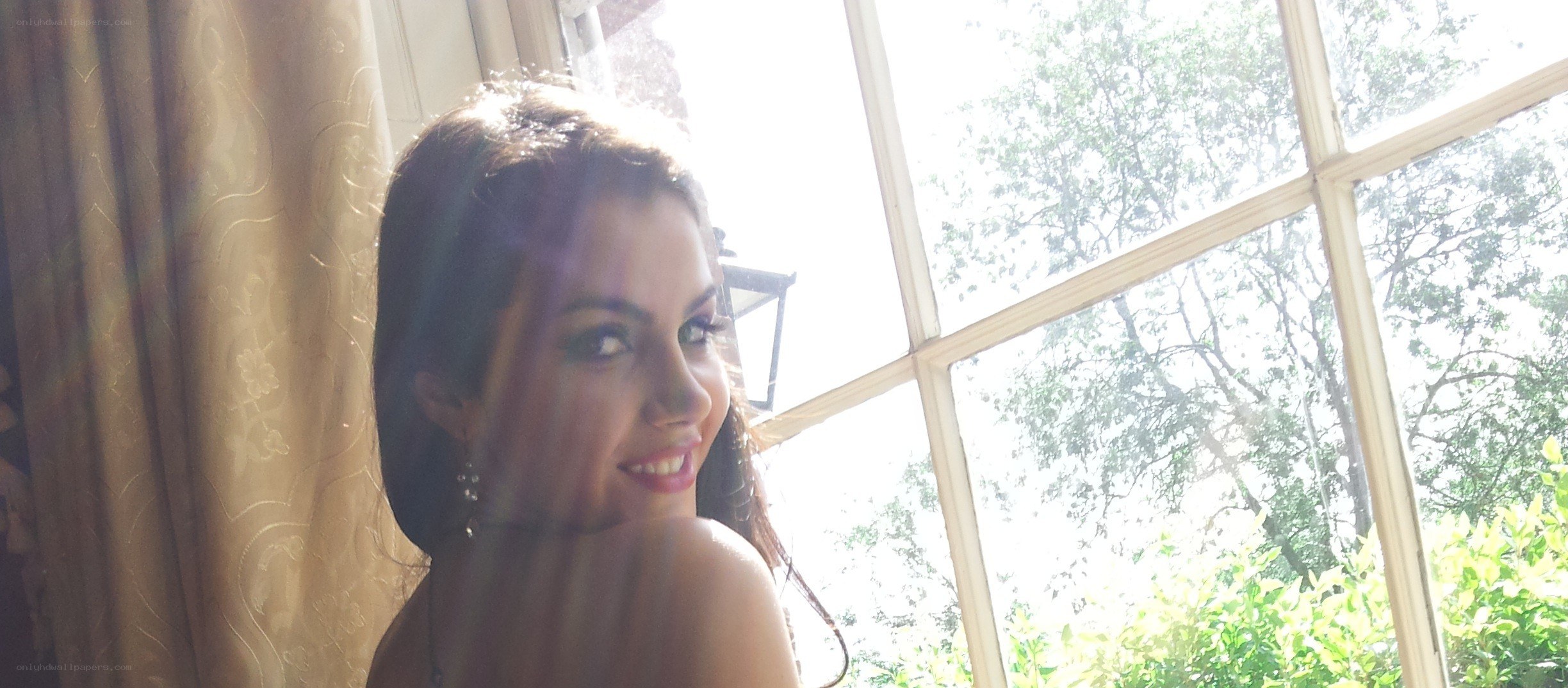 woman by window with sunlight