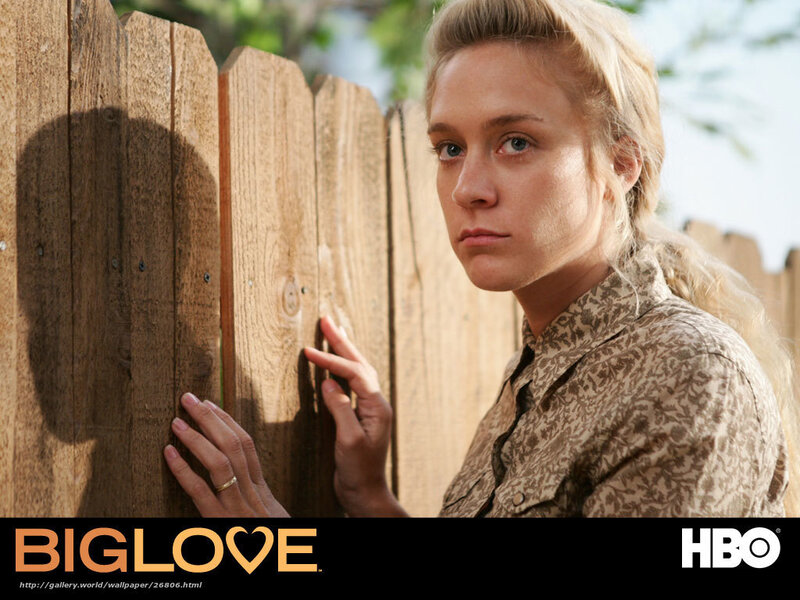 woman by wooden fence