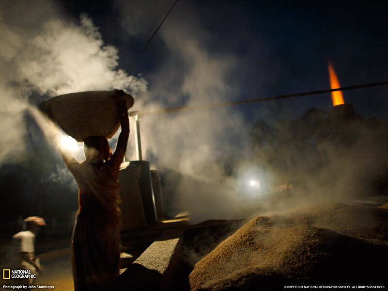 Woman carrying basket at night