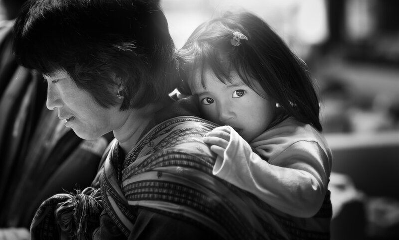 Woman Carrying Child