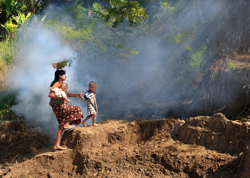 Woman Carrying Children