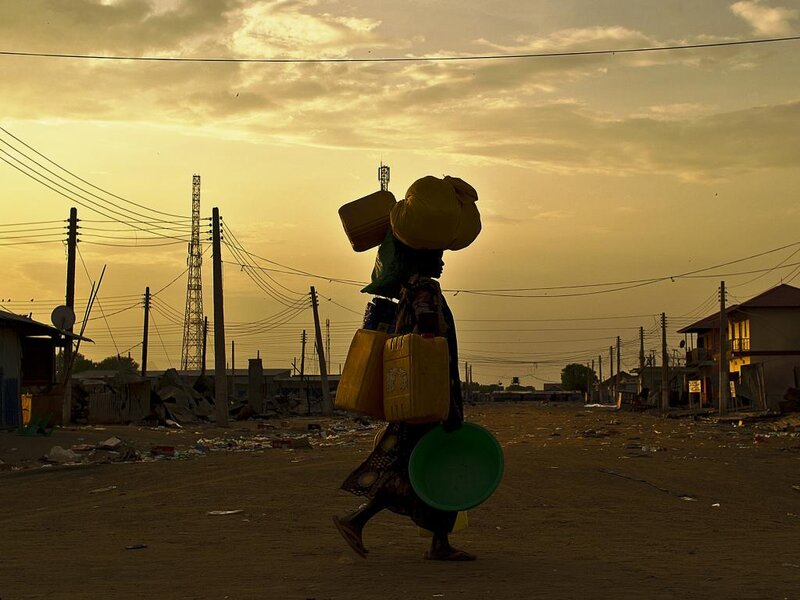 Woman Carrying Containers