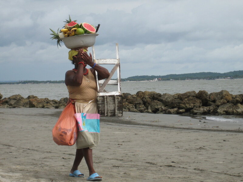 Woman Carrying Fruit Bowl