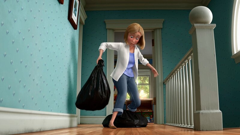 woman carrying trash bags