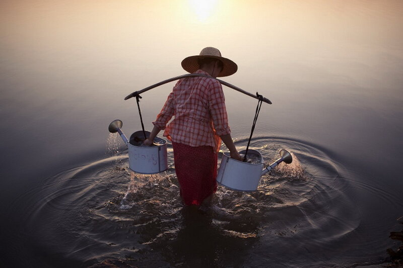 Woman Carrying Water Buckets