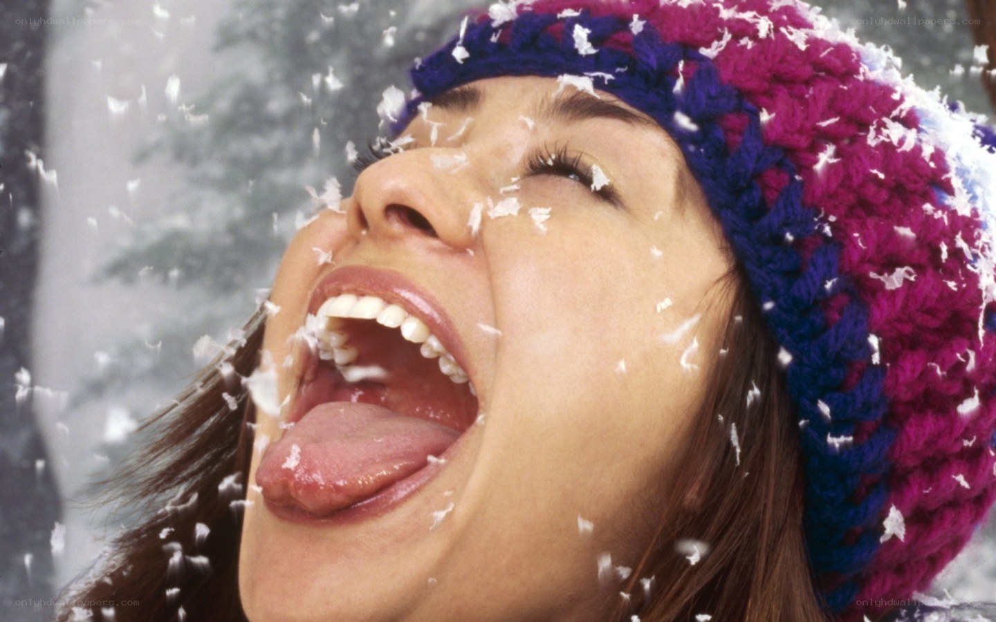 woman catching snowflakes