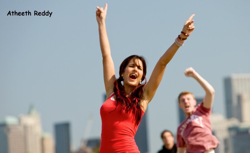 woman celebrating with arms raised