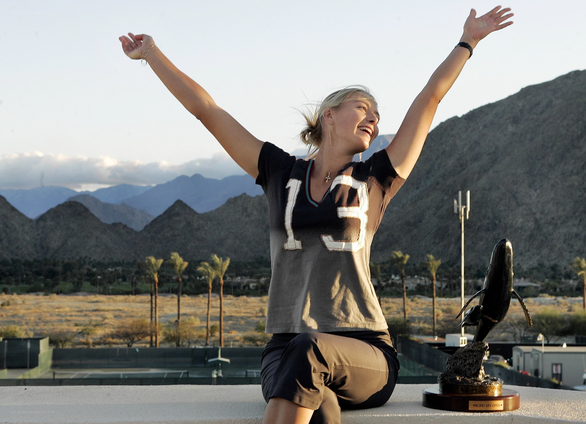 Woman celebrating with trophy