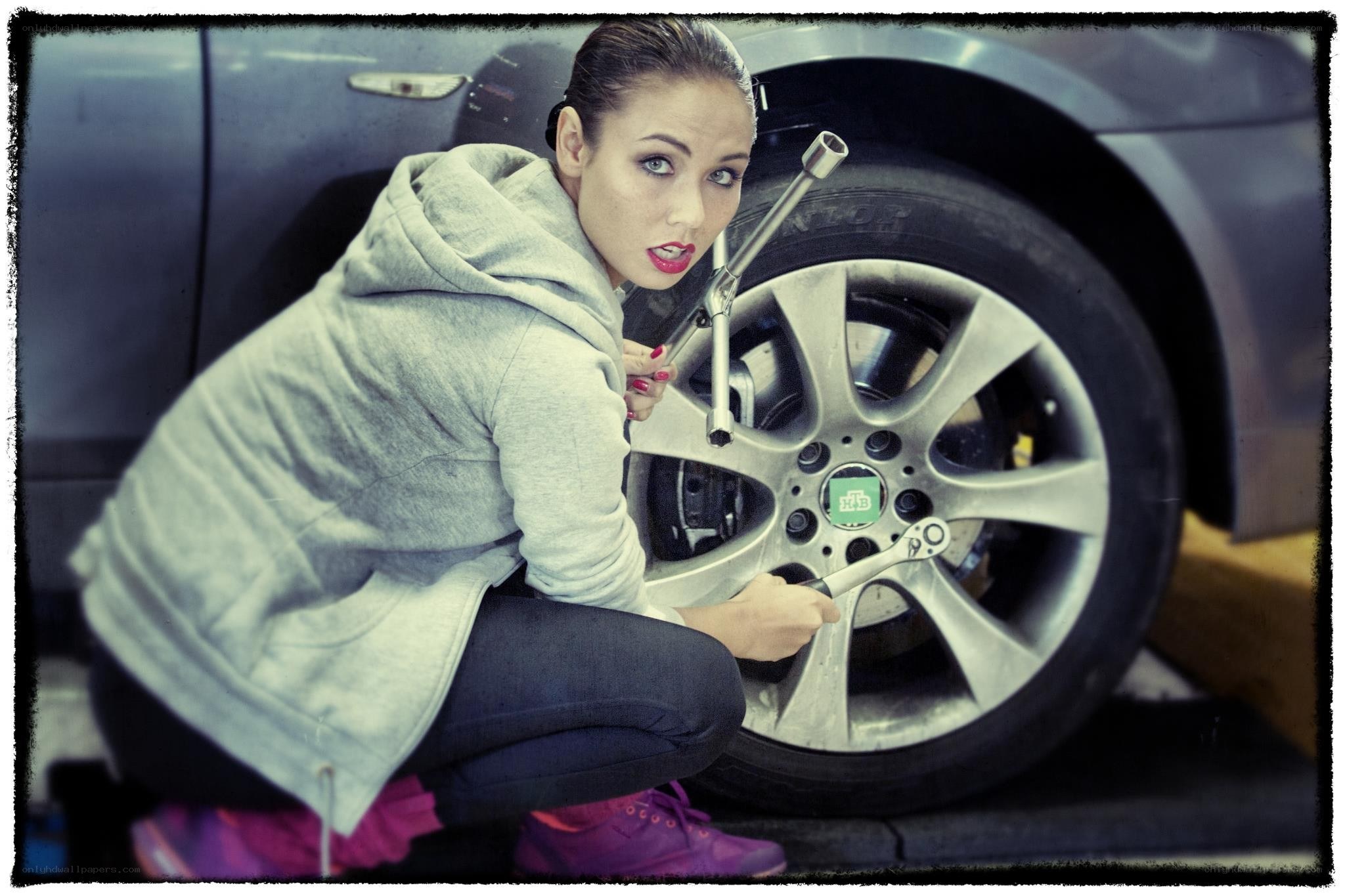 woman changing a tire