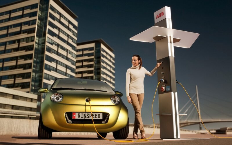 woman charging electric car