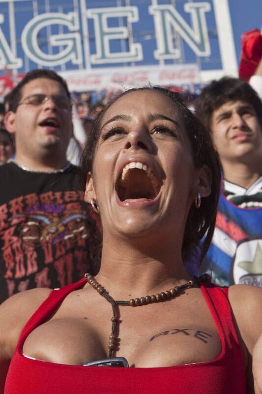 Woman cheering at a sporting event