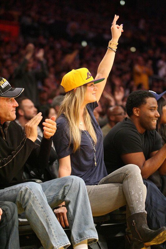 Woman cheering at basketball game