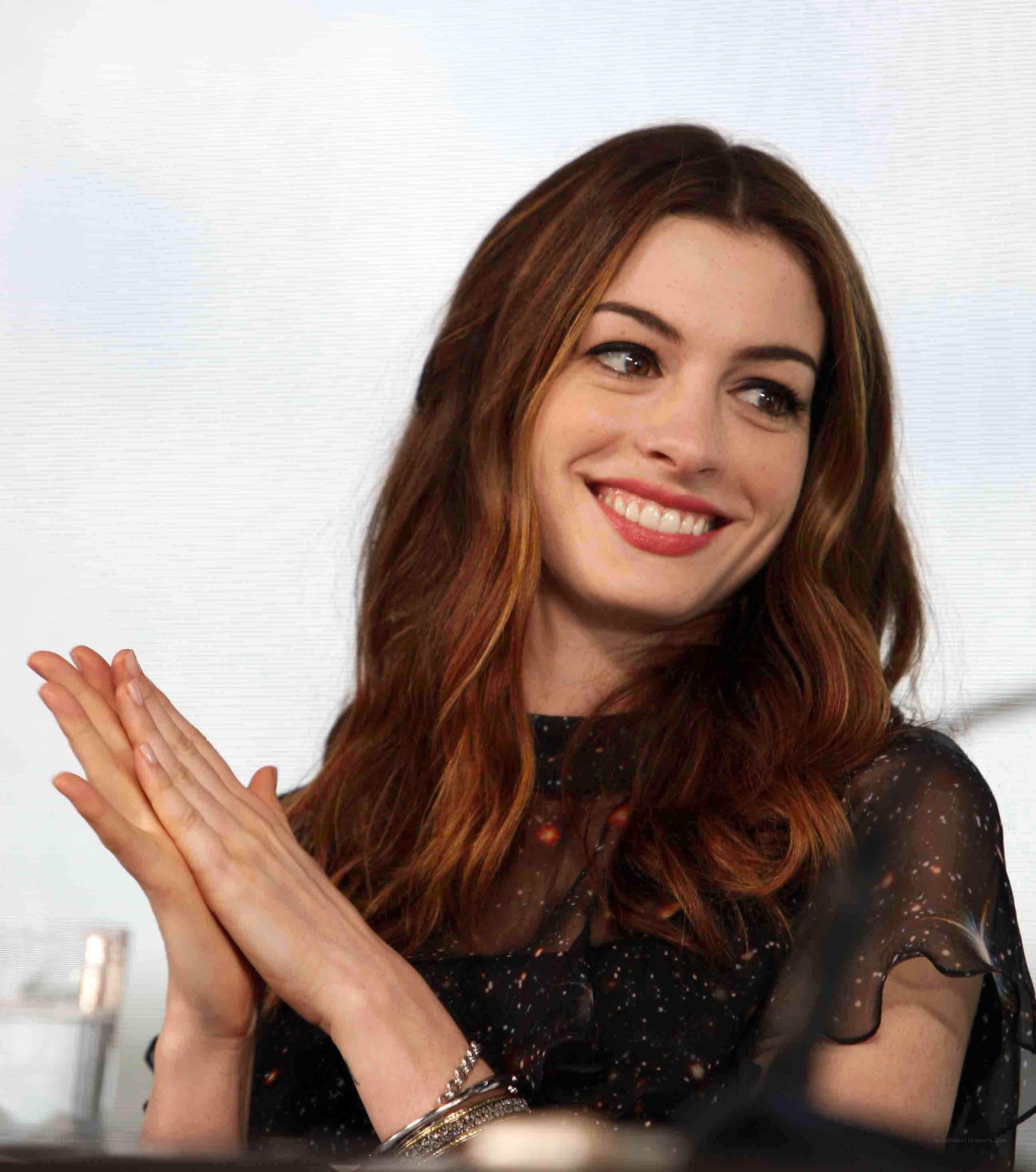 woman clapping at event