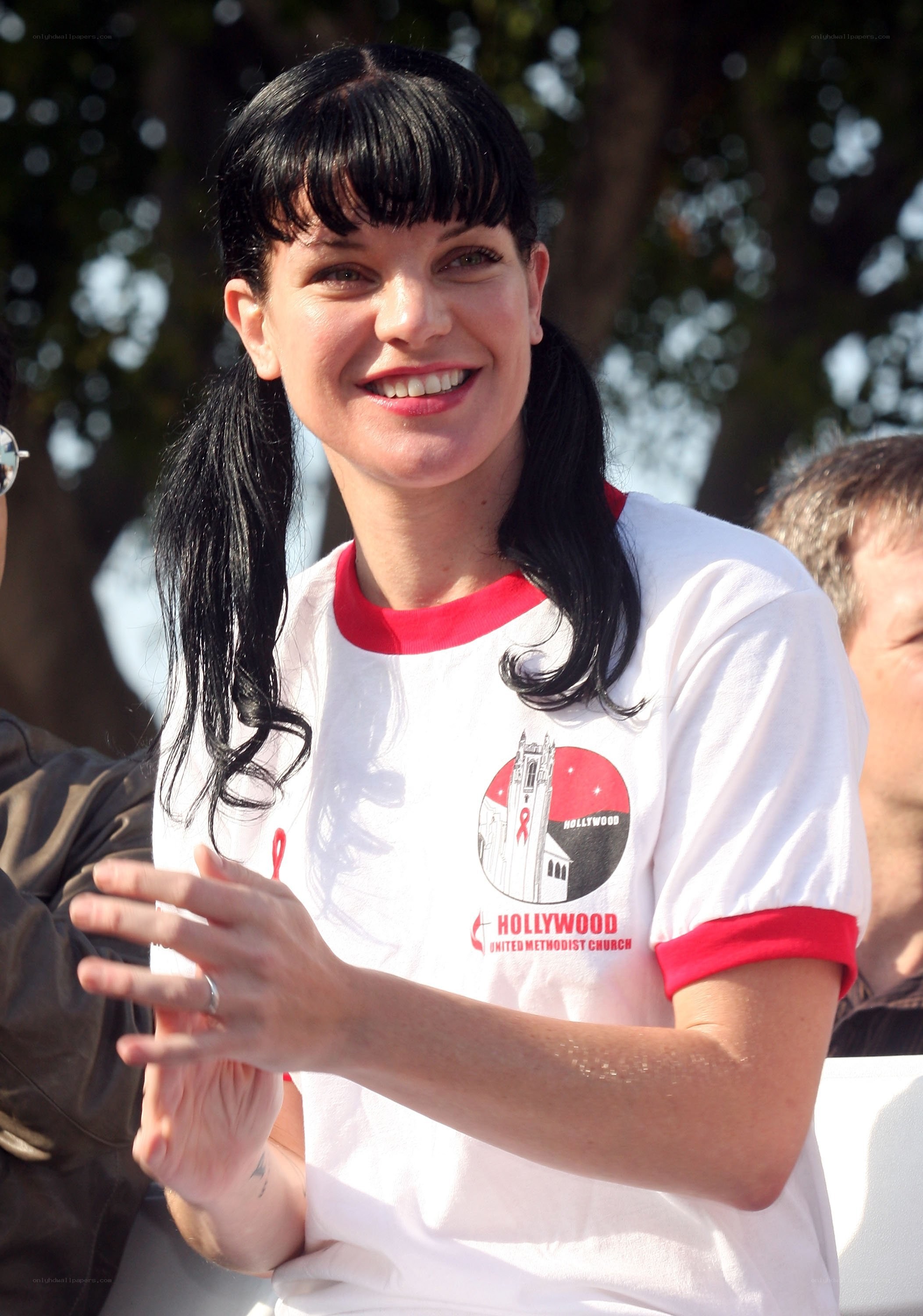 woman clapping at event