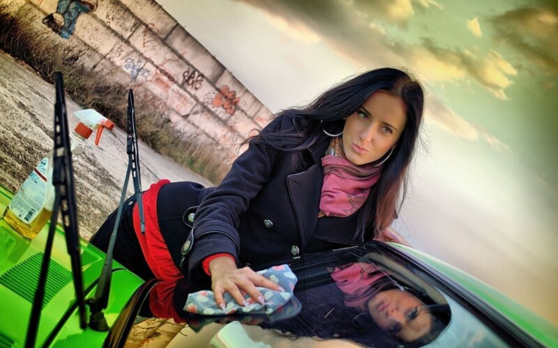 Woman Cleaning Car Window