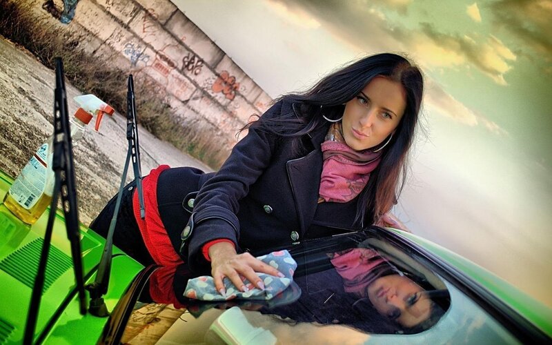 Woman Cleaning Car Windshield — Green