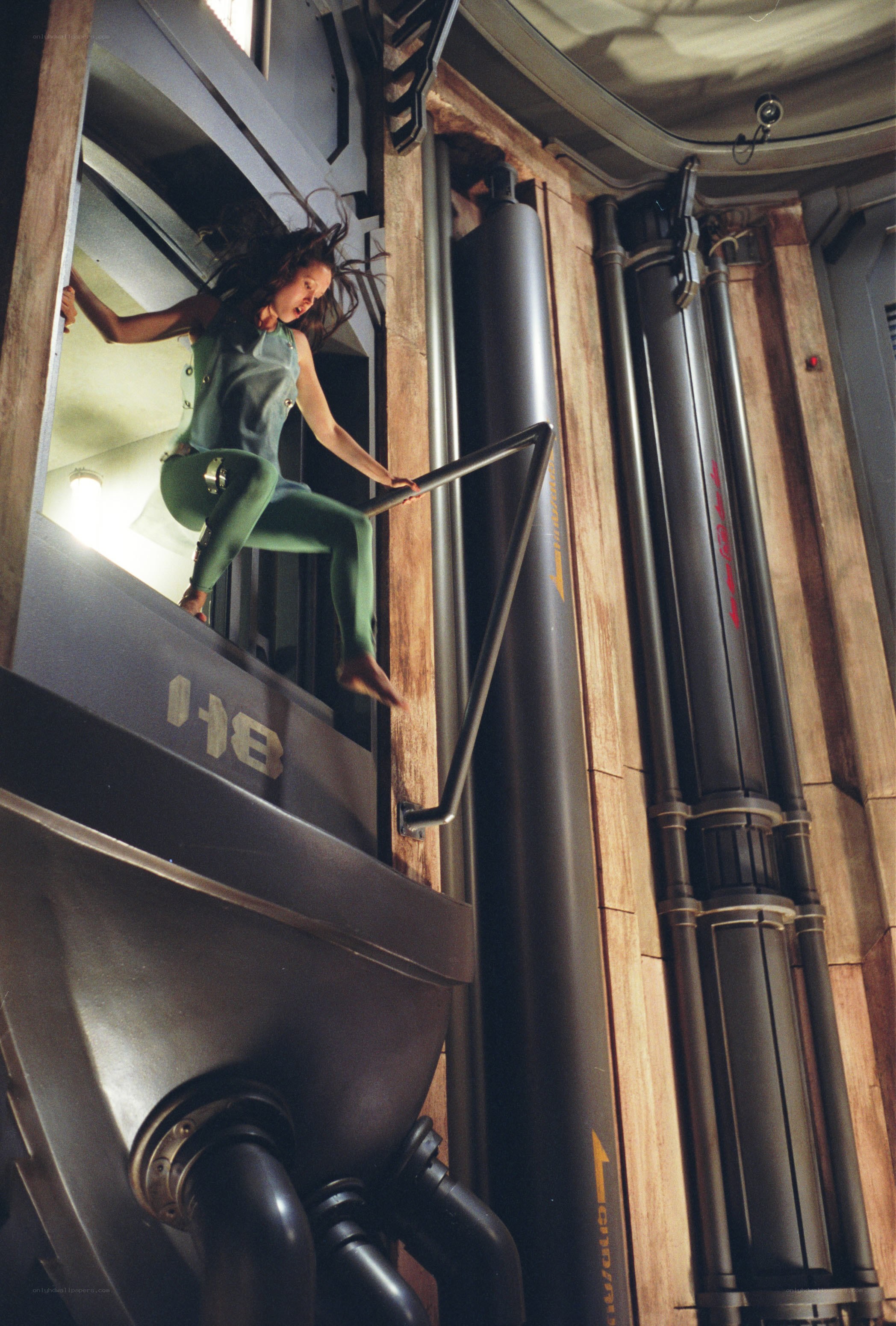 woman climbing in sci-fi corridor
