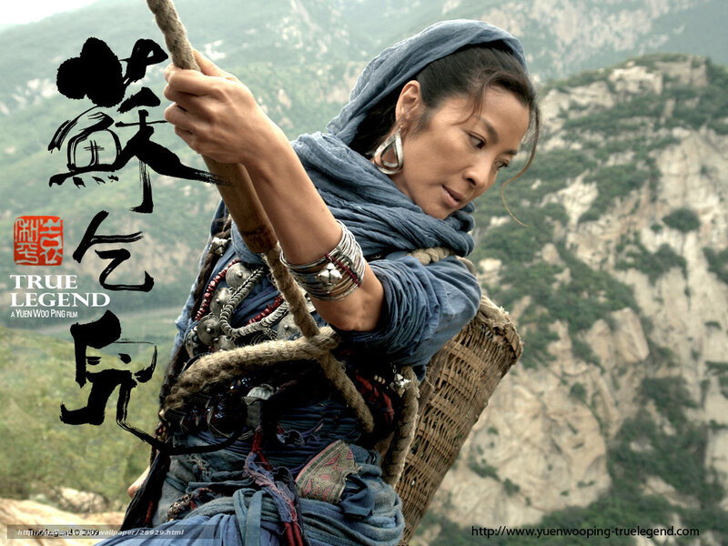 Woman Climbing Mountain