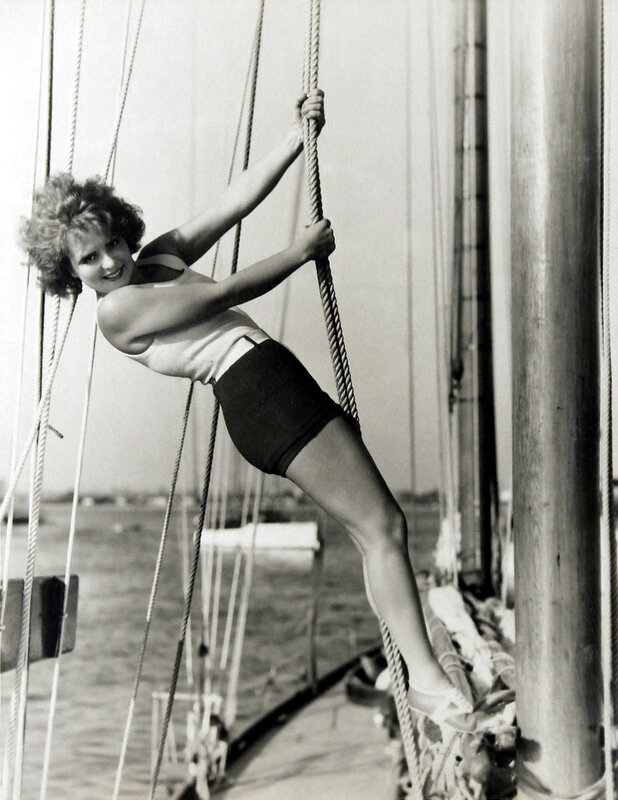 Woman climbing ship rigging