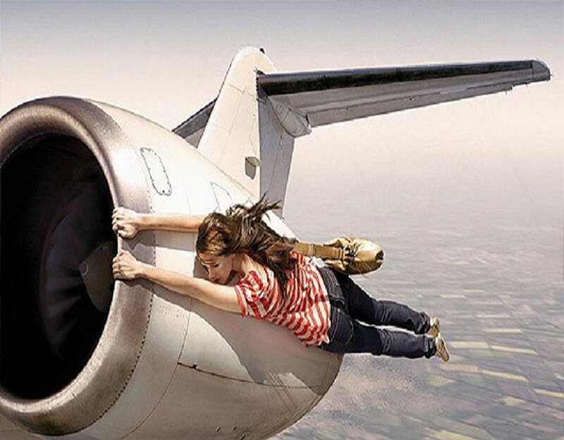 Woman clinging to airplane engine