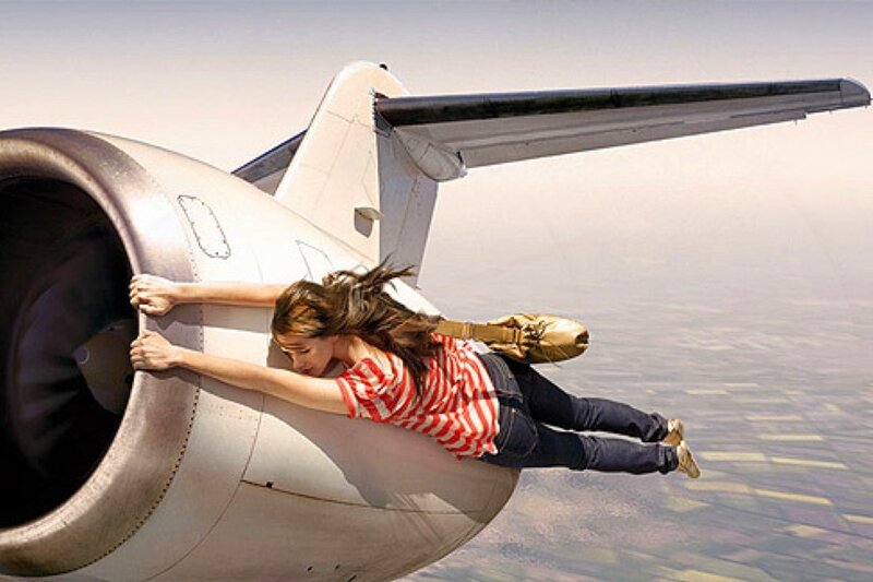 woman clinging to airplane engine