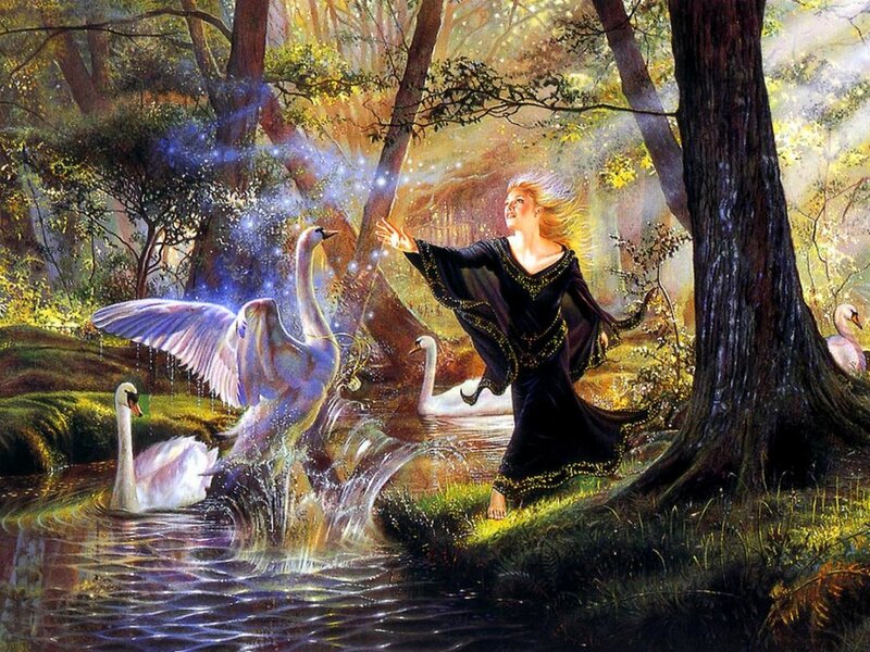 Woman conjuring swans in a forest
