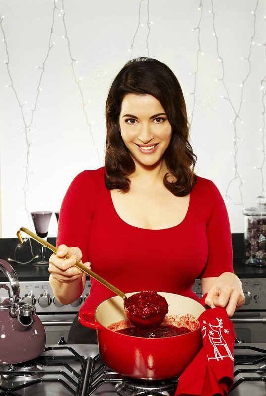 woman cooking cranberry sauce