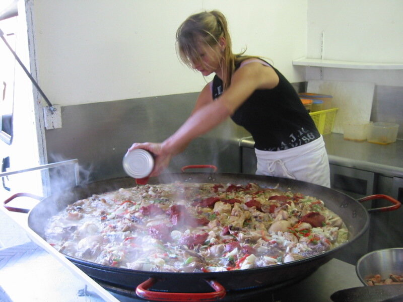 Woman Cooking Paella