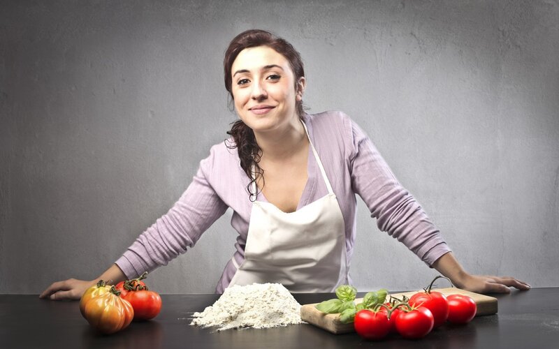 woman cooking with fresh ingredients