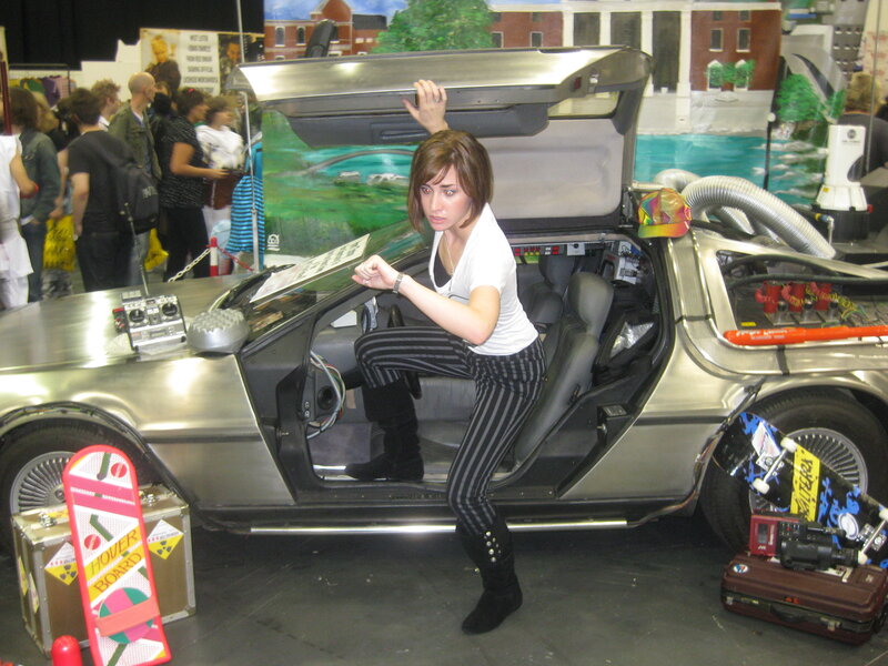 Woman cosplaying in DeLorean