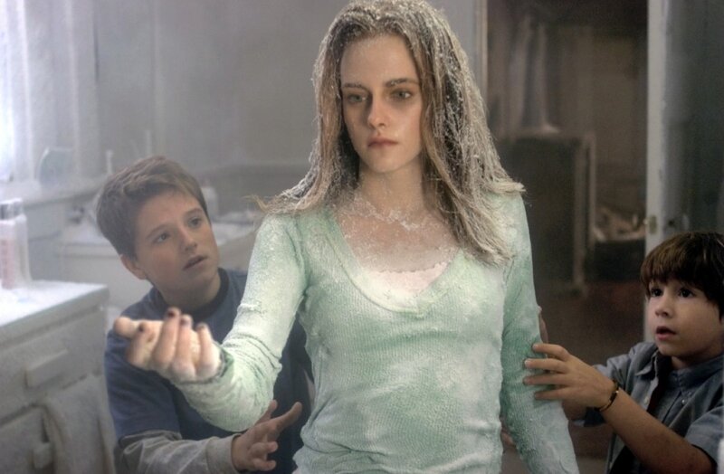 woman covered in frost with children