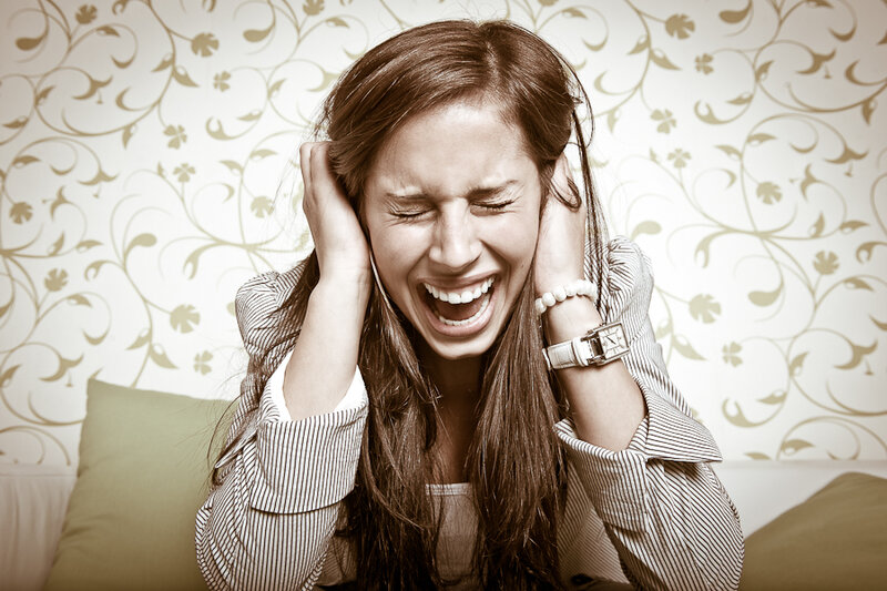 Woman Covering Ears