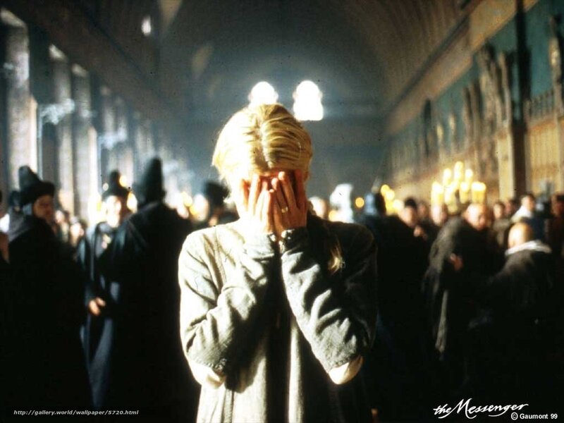 woman covering face in crowd